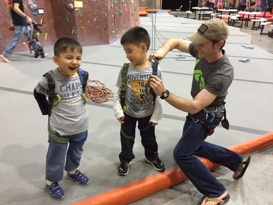 Boys getting in their little harnesses.