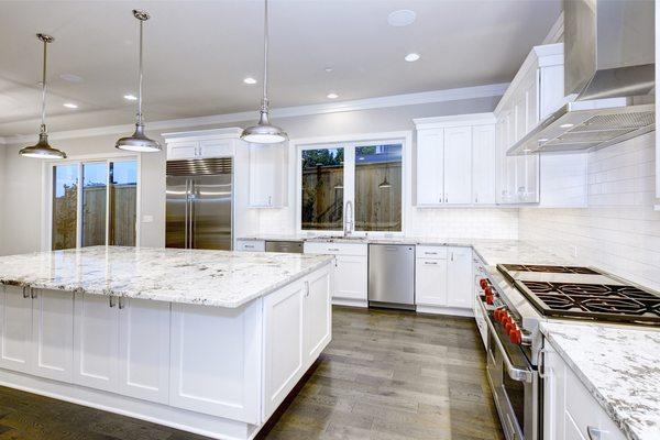 White Shaker Cabinets with Granite Counter-Top, and SPC Flooring