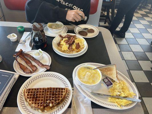 Breakfast! All Star with pumpkin waffle, scrambled eggs & bacon .  Bacon, Egg & Cheese has brown bowl, side of sausage & grits.