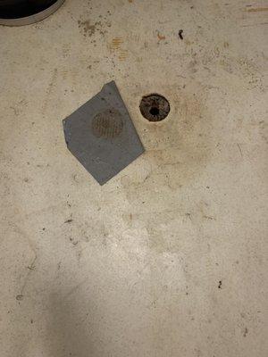 An example of the gorgeous linoleum filled with prior renter's sewage water they didn't clean after a plumbing backup. They TAPED OVER IT.