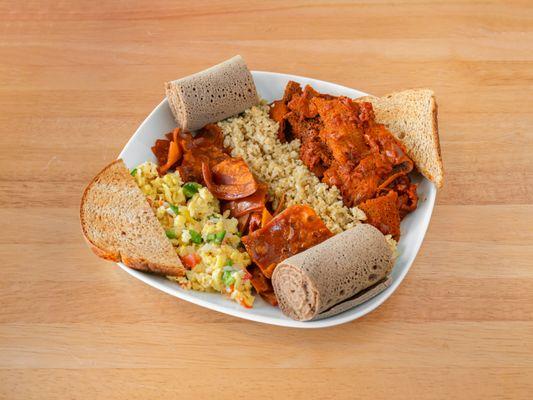 Ethiopian Breakfast Combo (scrambled eggs, chechebsa, kinche and fir-fir)