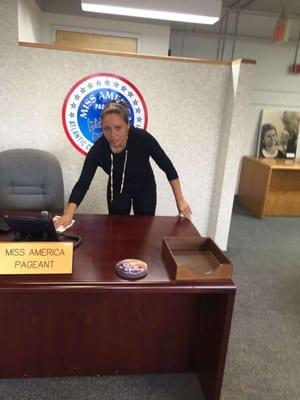 Cristine cleaning Miss America's office