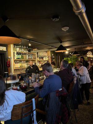 the bar where the bartender works his magic on you while you make new friends or just enjoy a drink yourself