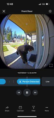 UPS driver moving the package Amazon left in plain view.