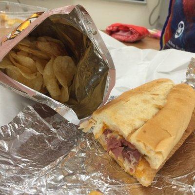 Hot pastrami sub with chips