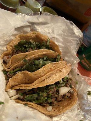 3 carne asada tacos unwrapped for take out