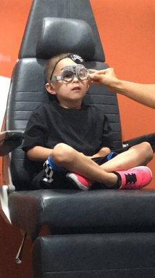 Looking adorable during his eye exam