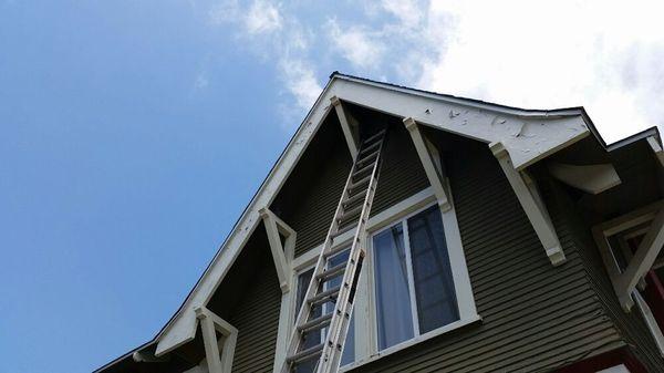 Installing bird spike on the corbels to keep the pigeons out.