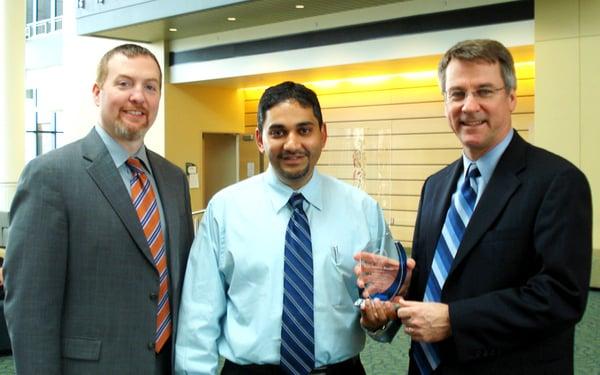 Dr. Mayur Shah, CEO of MK Education, presents a donation to the College of DuPage for the COD Scholarship Fund.