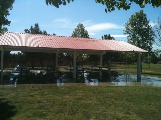 Covered area with picnic tables and barbecue grills