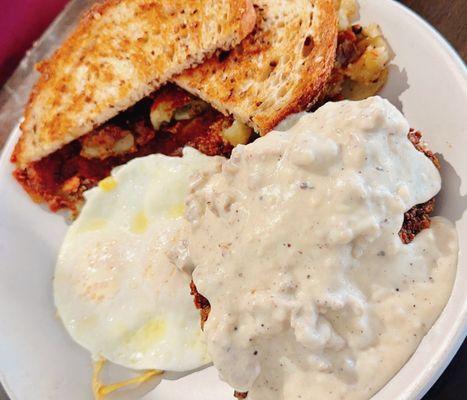 Chicken fried steak and country gravy, over medium eggs, breakfast potatoes and toast