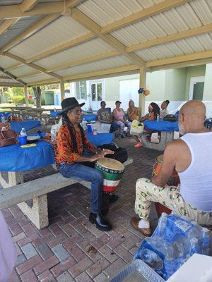 Papaloko and Baba Ade drumming in Williams Park.