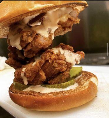 Our "New Market"  boneless fried chicken thigh topped with our bbq aioli and bread and butter pickles