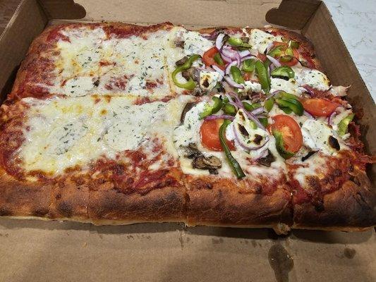 Half cheese, half veggie Sicilian w/ ricotta dollops. I wasn't a fan of the bread and the sauce seemed different than what's on the NY pies.