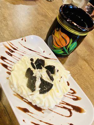 Oreo cookie Tres Leche cake and a cup of Cafe de Olla (cinnamon coffee)