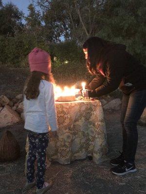 Celebrating Winter Solstice with lighting candles and a walking labyrinth.