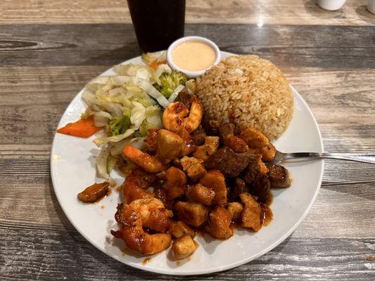 Hibachi Triple, Chicken, Shrimp and Steak with Veggies and fried rice.