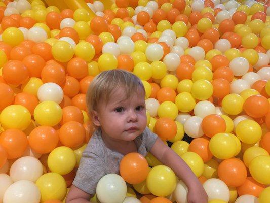 Arya playing in the huge ball pit