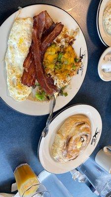 Traditional breakfast, 4 slices of bacon, loaded hash browns, 2 eggs and a biscuit.