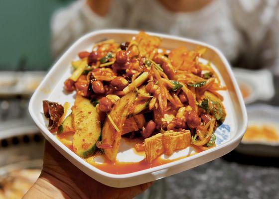 Very authentic Northeastern style salad with peanuts and cucumbers.