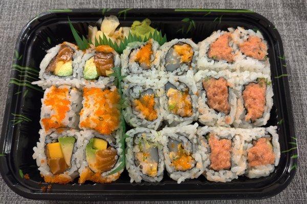 Sushi rolls (left to right: salmon avocado, spicy scallop, spicy tuna)