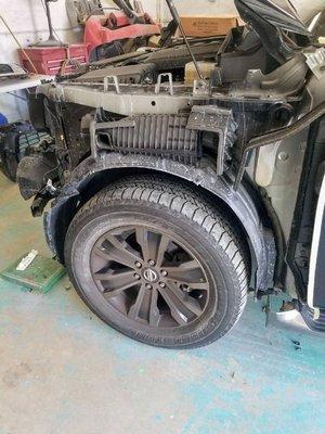 2017 Nissan Armada Platinum with left front end damage.