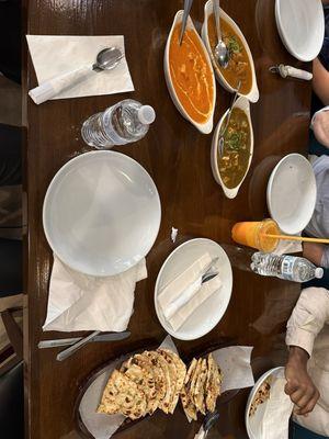 Chettinad curry, butter chicken, Paneer Pakoda, and garlic naan