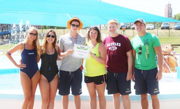 Staff members posing with the Little Pipsqueaks runner-up award of "Favorite Pool 2016."