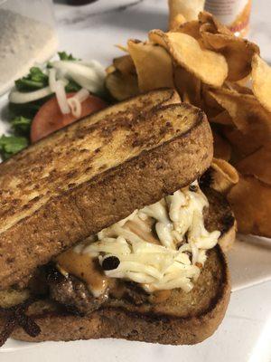 Campfire burger. 1/2 lb patty, sautéed onions, campfire sauce and shredded mozzarella on toast.