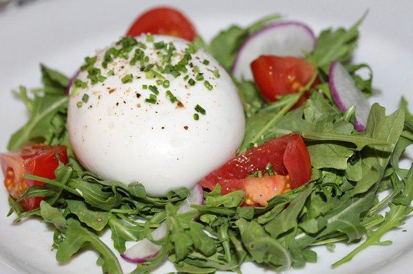 The Burrata was made with Cow's Milk Burrata, Wild Arugula, Passion Fruit Dressing & Campari Tomatoes.