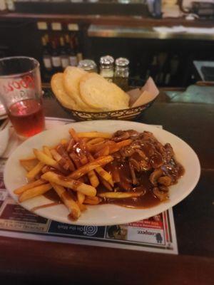 Hamburger Steak with Mushrooms and gravy served with french fries and gravy