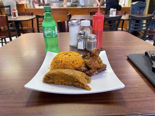 Arroz con gandules, pork chops and pastele.