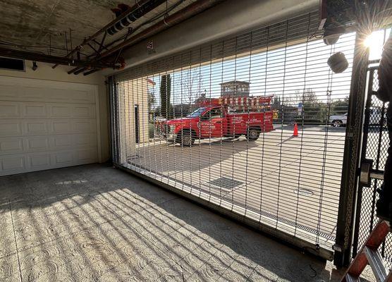 R&S Erection of Concord repairing a security grille