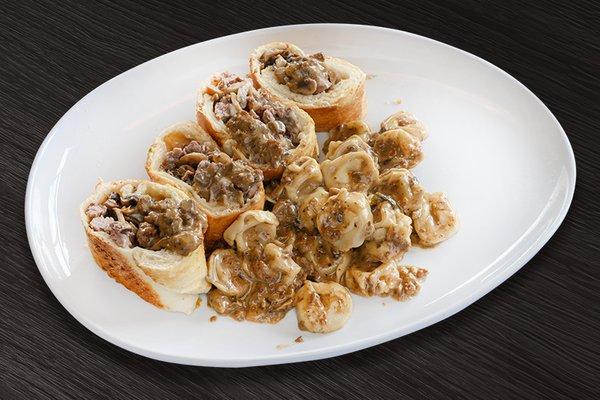 Signature Anelli Filetto: Beef tenderloin, onions, Porcini mushrooms, mozzarella cheese.