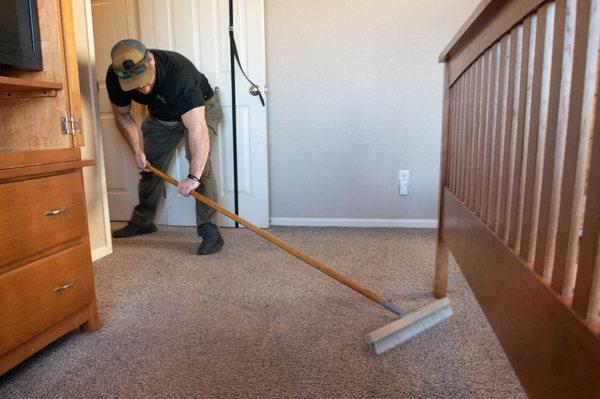 Step 5: Final grooming to reset carpet pile. Optional stain Guard protection added.