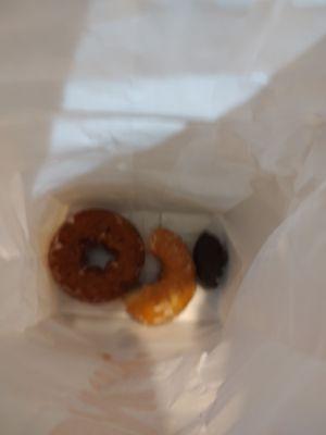 Pumpkin donut, glazed, and part of chocolate