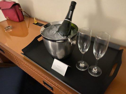 Room service delivery of sparkling wine