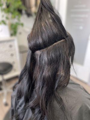 Volume weft extensions with hidden bead technique