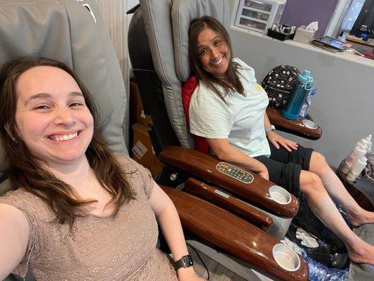 My friend and I getting our pedicures. The massage chairs were very comfy!