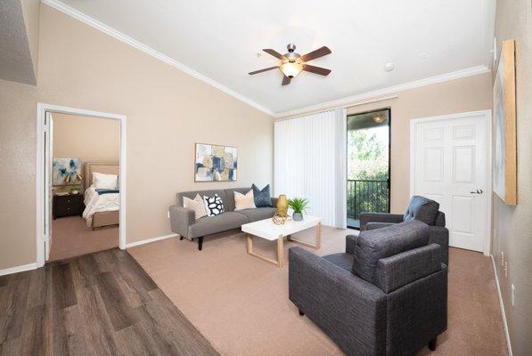 Living room with ceiling fan at Briargrove at Vail