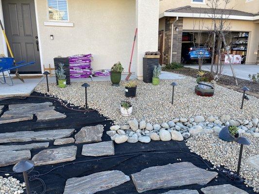 Dry river bed and placing plants. The team made sure we were happy with the placement.