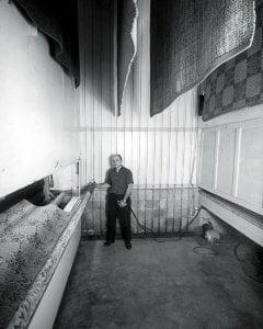 Gerald Ziegler circa 1956, in the rug drying room pulling up area rugs at the Fairfield County, Danbury, CT