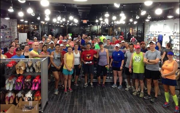 In Flight members pack the newly remodeled Fleet Feet Rice store before a Saturday store long run.