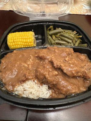 Country style steak over rice, green beans, corn on the cobb