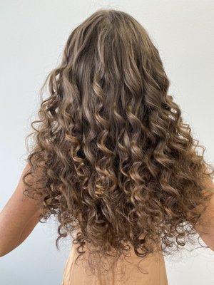 Custom curly extensions using the natural beaded row technique.