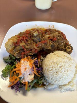 Oxtail with rice and salad.  Comes with side of beans not pictured.