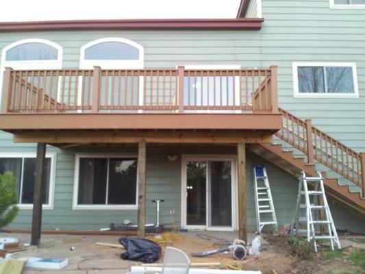 Second level deck with staircase. Trex deck material over pressure treated framing.