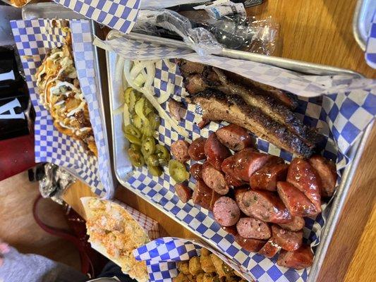 Sausage! Brisket! Potato salad! Potato wedges with brisket!