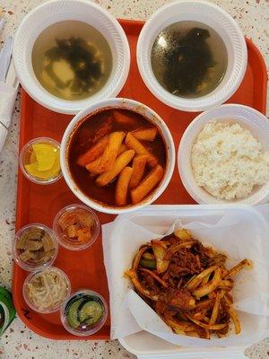 Spicy rice cake, spicy pork, rice & sides.