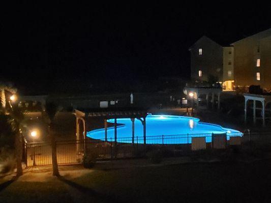 Night shot of pool. Lights come on at 8:08!